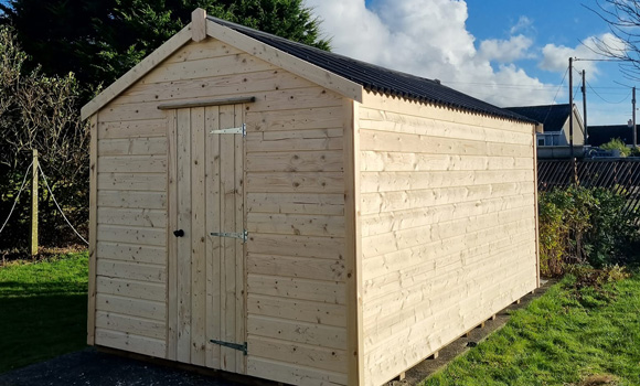 wooden shed in garden by SC Joinery and Landscaping
